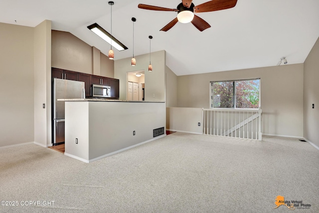 7612 Lumbis Ave # 4, Anchorage, AK 99518 - unfurnished living room featuring carpet floors, a ceiling fan, and high vaulted ceiling