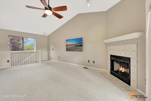 7612 Lumbis Ave # 4, Anchorage, AK 99518 - unfurnished living room with a ceiling fan, carpet floors, high vaulted ceiling, and a fireplace