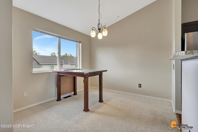 7612 Lumbis Ave # 4, Anchorage, AK 99518 - unfurnished dining area featuring carpet floors and vaulted ceiling