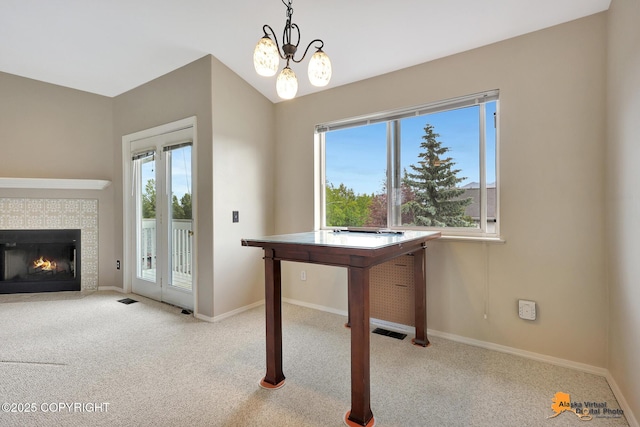7612 Lumbis Ave # 4, Anchorage, AK 99518 - unfurnished dining area featuring carpet and a tile fireplace
