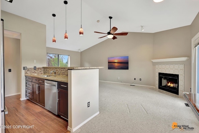 7612 Lumbis Ave # 4, Anchorage, AK 99518 - kitchen featuring stainless steel dishwasher, open floor plan, a ceiling fan, dark brown cabinets, and pendant lighting