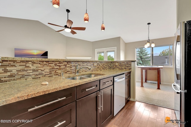 7612 Lumbis Ave # 4, Anchorage, AK 99518 - kitchen featuring appliances with stainless steel finishes, dark brown cabinets, a ceiling fan, lofted ceiling, and tasteful backsplash