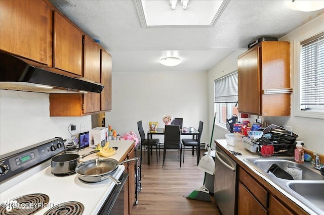 330 N Bliss St, Anchorage, AK 99508 - kitchen with white electric range oven, stainless steel dishwasher, light wood finished floors, and healthy amount of natural light