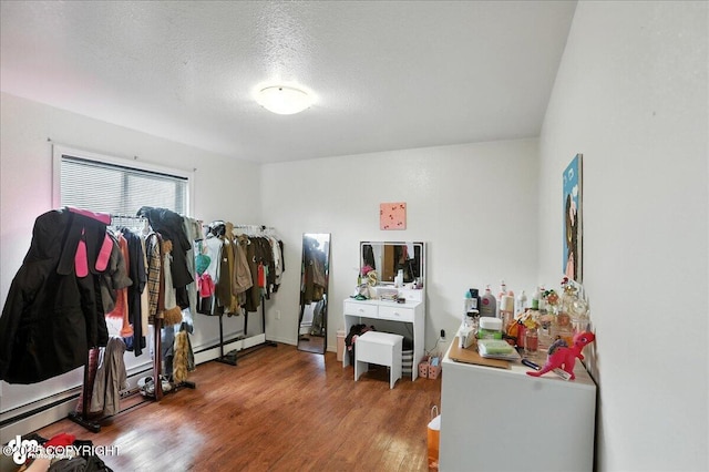 330 N Bliss St, Anchorage, AK 99508 - misc room with wood finished floors and a textured ceiling