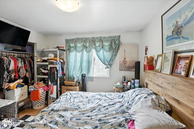 330 N Bliss St, Anchorage, AK 99508 - bedroom featuring a closet and wood finished floors