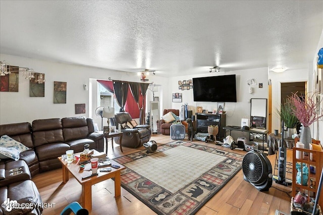 330 N Bliss St, Anchorage, AK 99508 - living area with a textured ceiling and wood finished floors