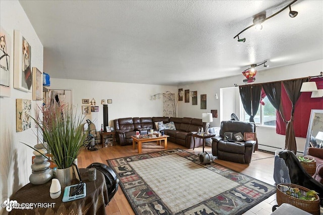 330 N Bliss St, Anchorage, AK 99508 - living room with wood-type flooring and a textured ceiling