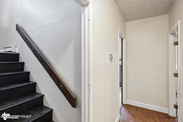 18723 N Lowrie Loop, Eagle River, AK 99577 - stairway with wood finished floors and baseboards