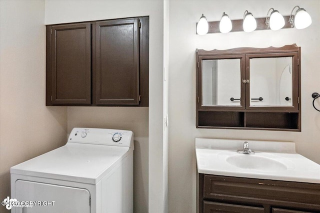 18723 N Lowrie Loop, Eagle River, AK 99577 - laundry area with washer / dryer and cabinet space