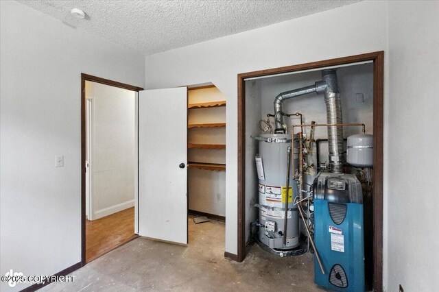 18723 N Lowrie Loop, Eagle River, AK 99577 - utility room featuring water heater