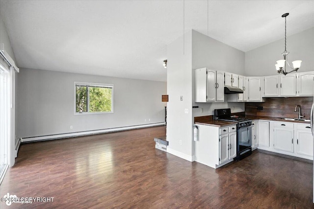 18723 N Lowrie Loop, Eagle River, AK 99577 - kitchen featuring black gas stove, under cabinet range hood, open floor plan, dark countertops, and a baseboard heating unit
