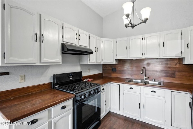 18723 N Lowrie Loop, Eagle River, AK 99577 - kitchen featuring under cabinet range hood, gas stove, a chandelier, white cabinetry, and lofted ceiling