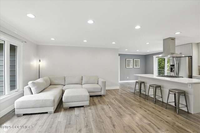 12220 Shiloh Rd, Anchorage, AK 99516 - living room featuring ornamental molding, light wood-type flooring, and recessed lighting