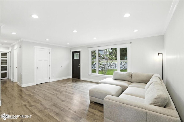 12220 Shiloh Rd, Anchorage, AK 99516 - living room featuring recessed lighting, wood finished floors, and ornamental molding