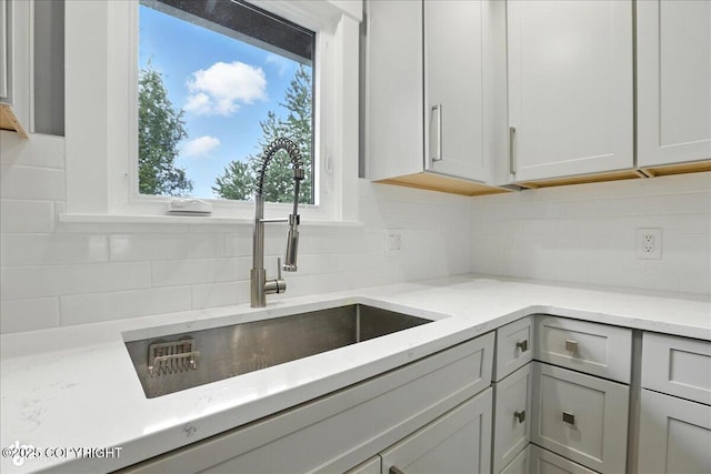12220 Shiloh Rd, Anchorage, AK 99516 - kitchen with backsplash and light stone counters