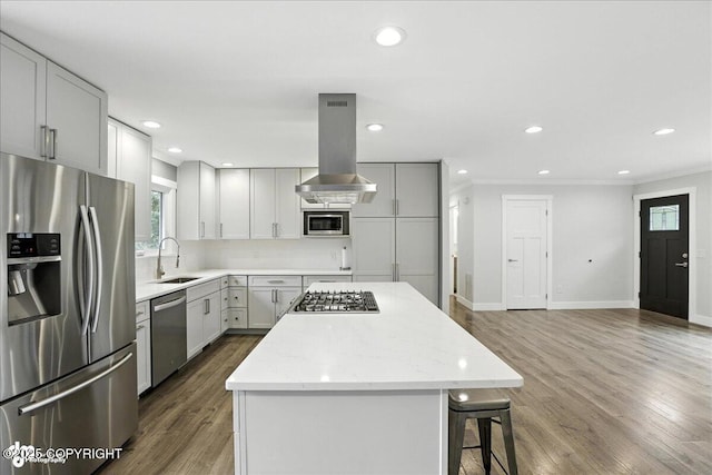 12220 Shiloh Rd, Anchorage, AK 99516 - kitchen featuring appliances with stainless steel finishes, island range hood, a center island, healthy amount of natural light, and recessed lighting