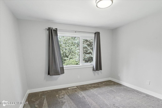 12220 Shiloh Rd, Anchorage, AK 99516 - carpeted empty room with baseboards