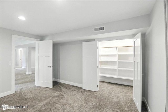 12220 Shiloh Rd, Anchorage, AK 99516 - unfurnished bedroom featuring carpet floors, a spacious closet, and a closet