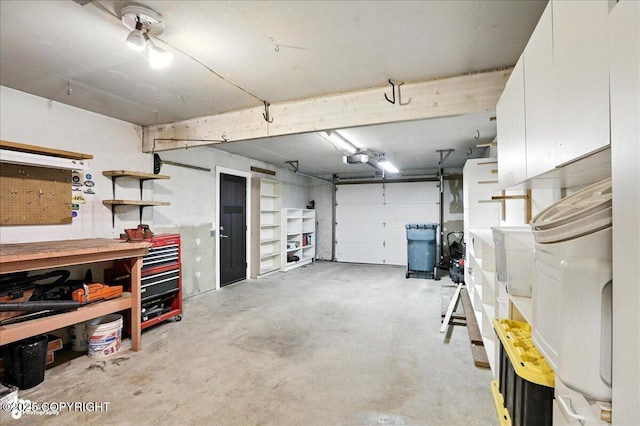12220 Shiloh Rd, Anchorage, AK 99516 - garage featuring a workshop area and a garage door opener
