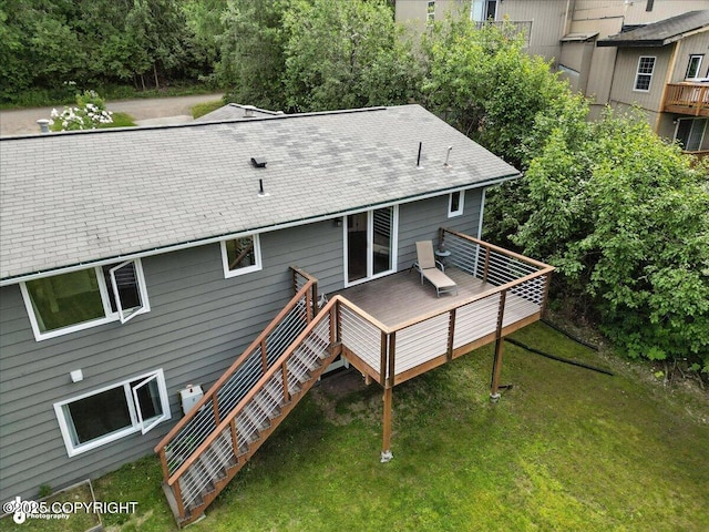 12220 Shiloh Rd, Anchorage, AK 99516 - back of house featuring a wooden deck, a lawn, roof with shingles, and stairway