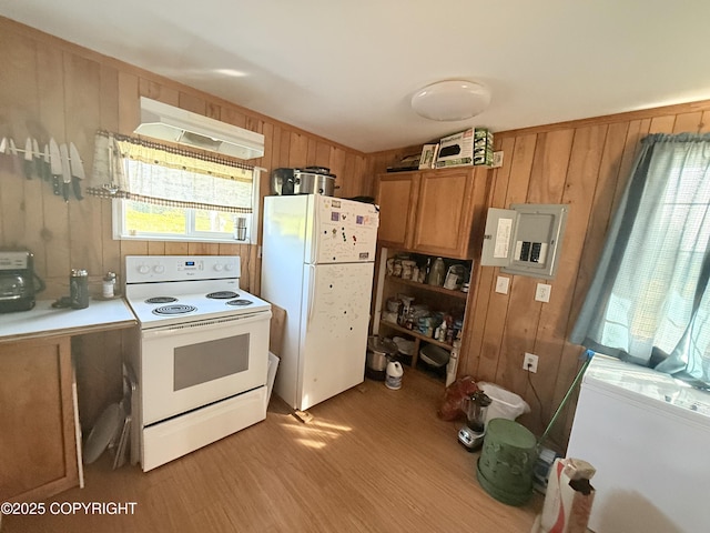 24220 Sterling Hwy, Ninilchik, AK 99639 - kitchen featuring white appliances, custom exhaust hood, light wood-type flooring, electric panel, and wooden walls