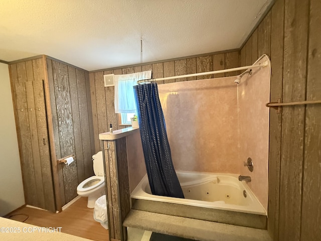 24220 Sterling Hwy, Ninilchik, AK 99639 - full bath with a combined bath / shower with jetted tub, wood finished floors, and a textured ceiling
