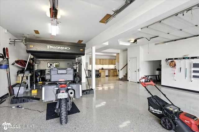 1677 Circlewood Dr, Anchorage, AK 99516 - garage featuring a garage door opener