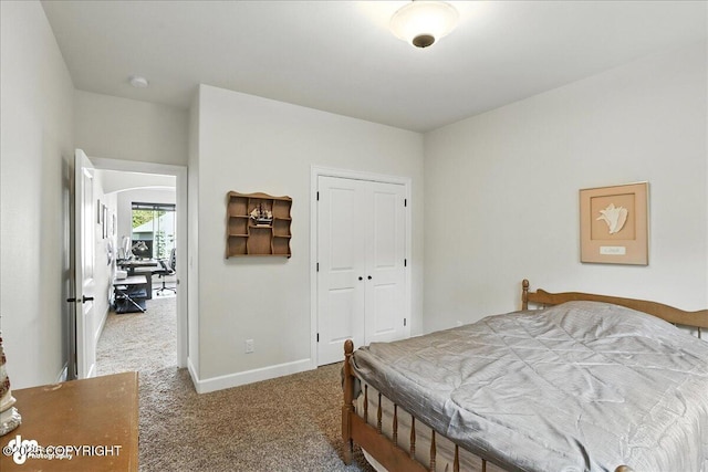 1677 Circlewood Dr, Anchorage, AK 99516 - bedroom with carpet, a closet, arched walkways, and a desk