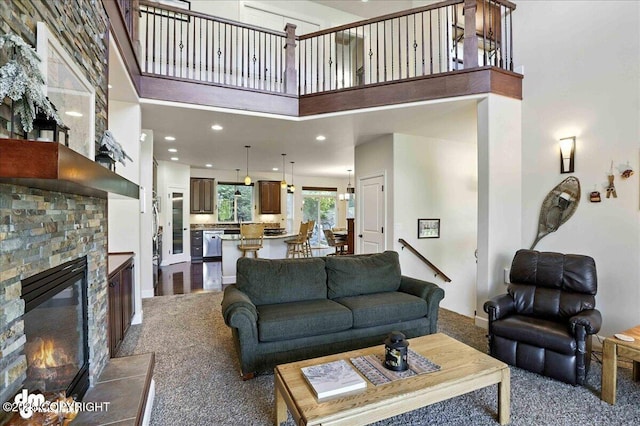1677 Circlewood Dr, Anchorage, AK 99516 - living room featuring dark carpet, a towering ceiling, and a stone fireplace