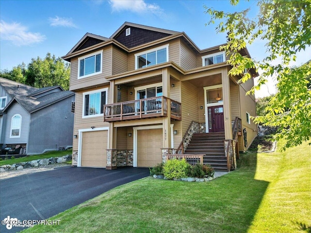 1677 Circlewood Dr, Anchorage, AK 99516 - craftsman-style house with a front lawn, asphalt driveway, and an attached garage