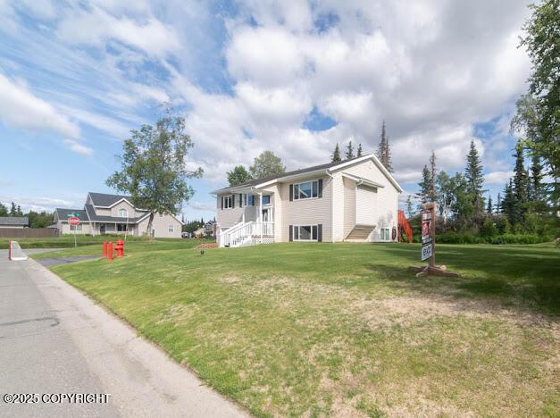 1207 Portside Dr, Kenai, AK 99611 - split foyer home with a front yard