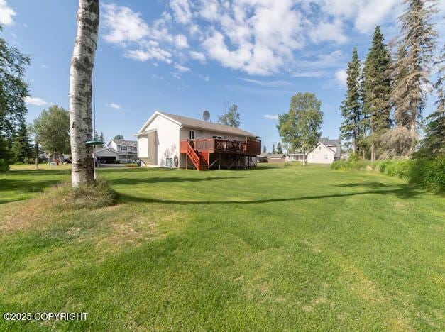 1207 Portside Dr, Kenai, AK 99611 - view of green lawn featuring a deck and stairs