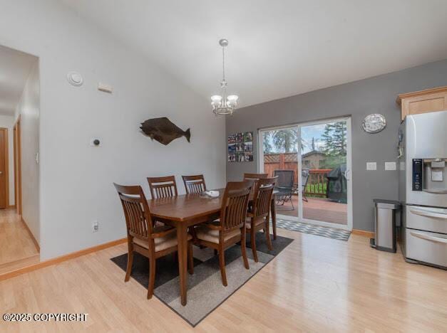 1207 Portside Dr, Kenai, AK 99611 - dining area featuring light wood-type flooring and a chandelier
