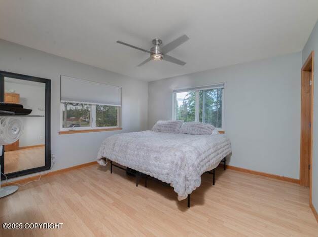 1207 Portside Dr, Kenai, AK 99611 - bedroom featuring wood finished floors and a ceiling fan