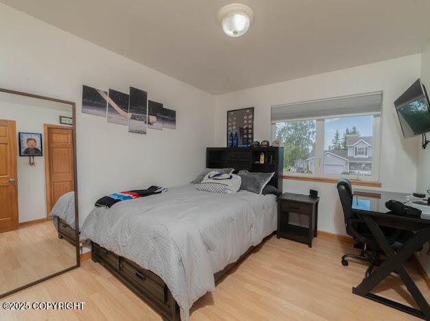 1207 Portside Dr, Kenai, AK 99611 - bedroom featuring light wood-style flooring and a desk