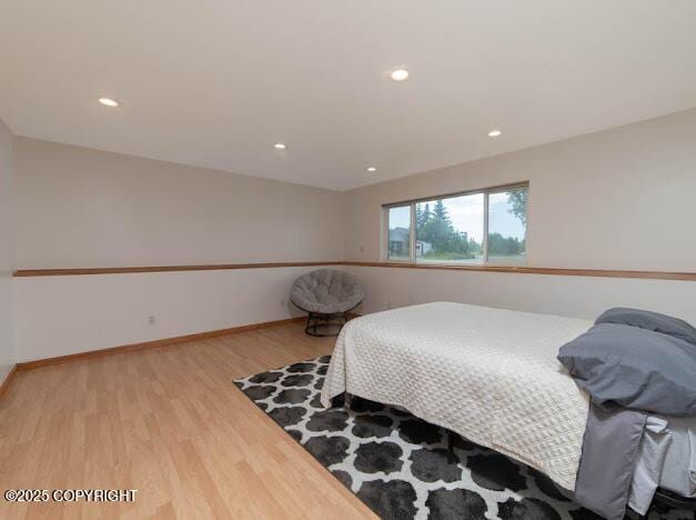 1207 Portside Dr, Kenai, AK 99611 - bedroom with wood finished floors and recessed lighting