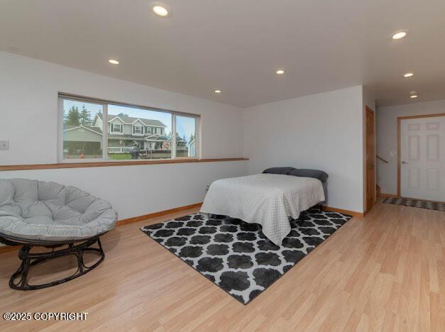 1207 Portside Dr, Kenai, AK 99611 - bedroom with wood finished floors and recessed lighting