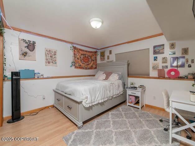 1207 Portside Dr, Kenai, AK 99611 - bedroom featuring light wood finished floors, ornamental molding, and an office area