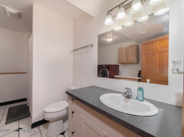 1207 Portside Dr, Kenai, AK 99611 - full bathroom with washer / clothes dryer, vanity, tile patterned floors, and a shower with shower curtain