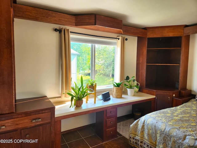 3920 Red Talon Dr, Anchorage, AK 99507 - bedroom featuring dark tile patterned flooring and a desk