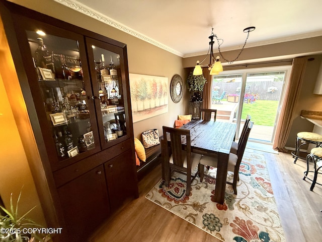 3920 Red Talon Dr, Anchorage, AK 99507 - dining space featuring wood finished floors and ornamental molding