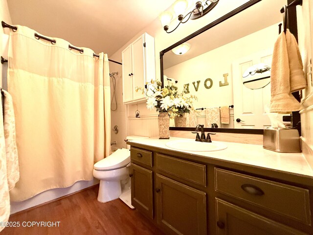 3920 Red Talon Dr, Anchorage, AK 99507 - bathroom featuring vanity, shower / bathtub combination with curtain, and wood finished floors