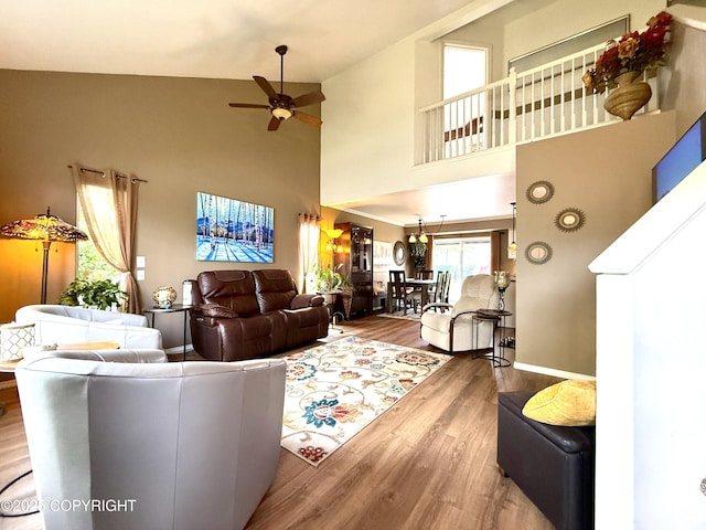 3920 Red Talon Dr, Anchorage, AK 99507 - living room with a ceiling fan, wood finished floors, and high vaulted ceiling