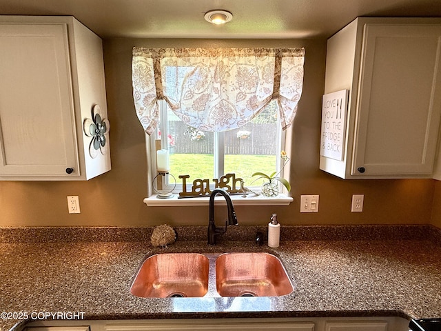 3920 Red Talon Dr, Anchorage, AK 99507 - kitchen view of white cabinetry and dark stone counters