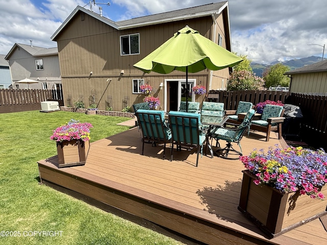 3920 Red Talon Dr, Anchorage, AK 99507 - wooden deck featuring a fenced backyard and outdoor dining space