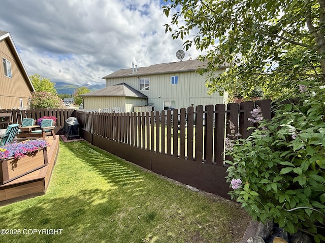 3920 Red Talon Dr, Anchorage, AK 99507 - fenced backyard with a wooden deck