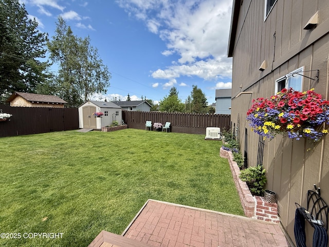 3920 Red Talon Dr, Anchorage, AK 99507 - fenced backyard featuring a storage unit and a patio
