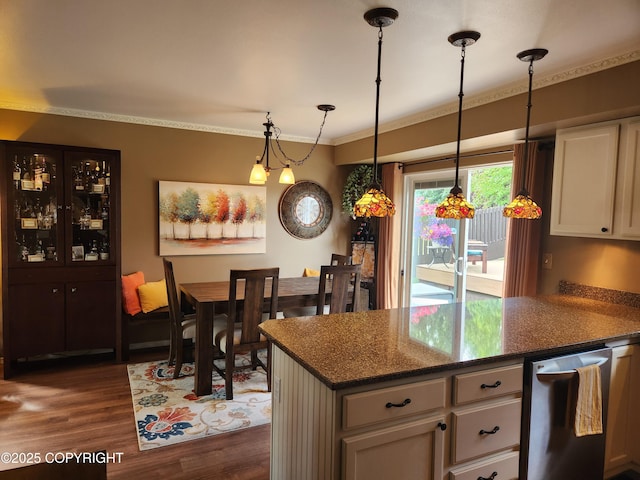3920 Red Talon Dr, Anchorage, AK 99507 - kitchen with dark wood finished floors, ornamental molding, hanging light fixtures, dishwasher, and white cabinetry