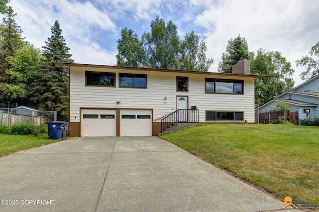 3223 Madison Way, Anchorage, AK 99508 - raised ranch featuring an attached garage, driveway, and a chimney