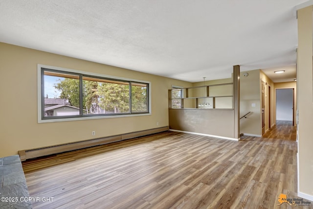3223 Madison Way, Anchorage, AK 99508 - unfurnished living room featuring a baseboard radiator and wood finished floors